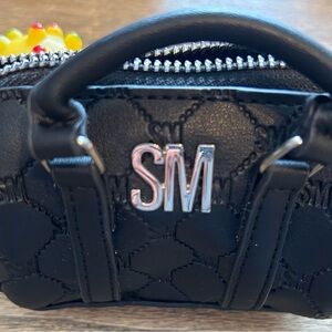 Black Quilted Women's change mini bag.